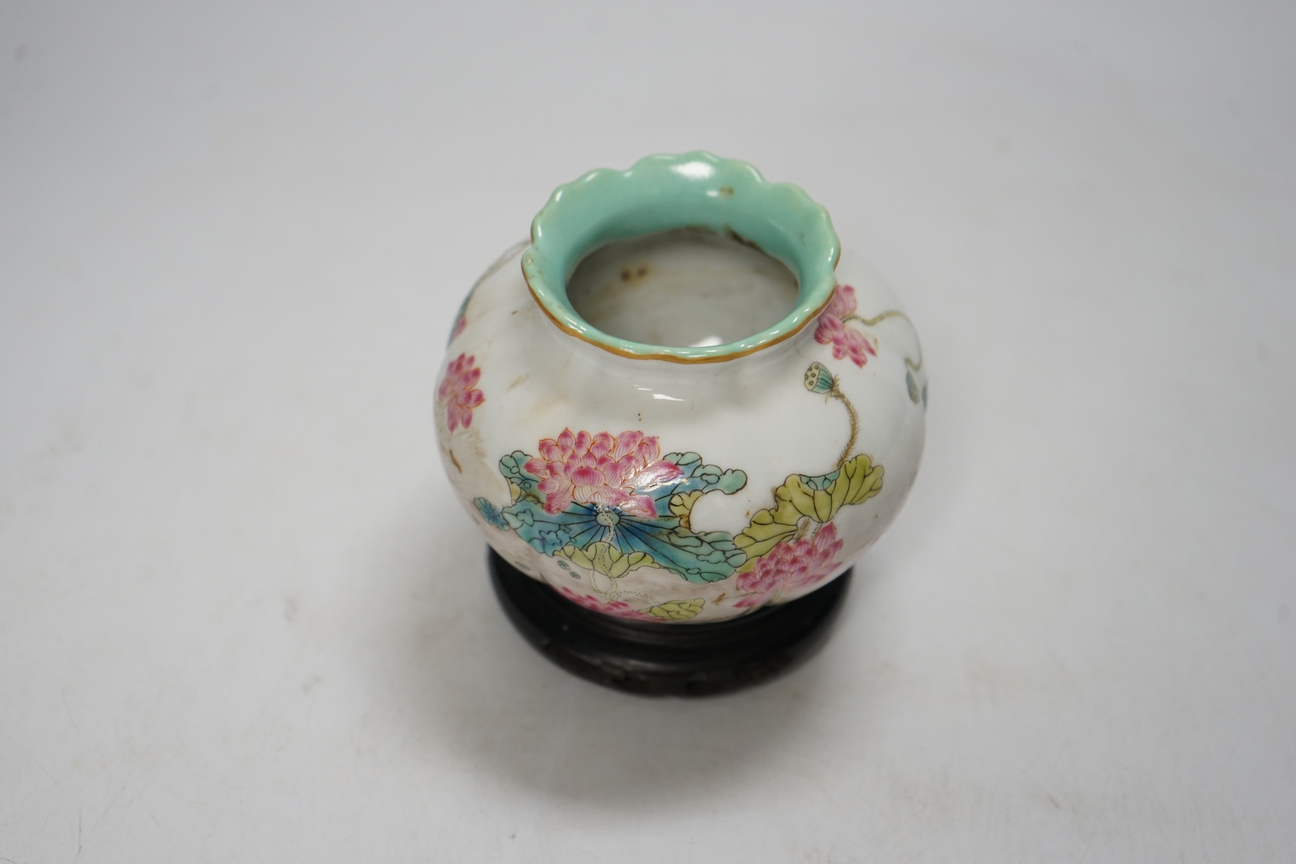 A Chinese famille rose water pot, Qianlong mark but later, on hardwood stand 9cm